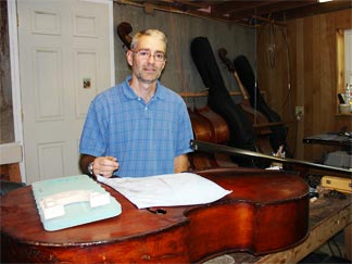 Dennis Roy working in his shop